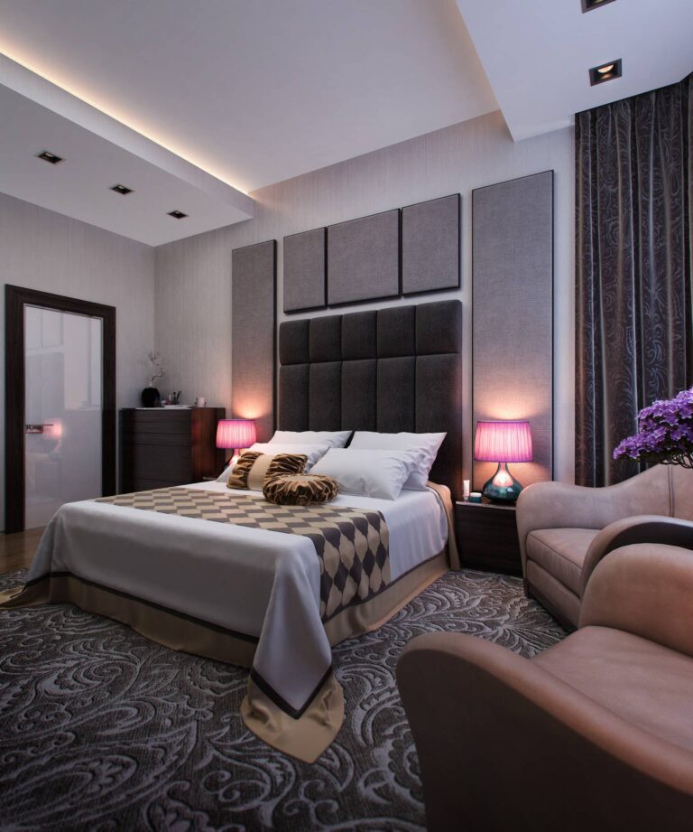 Двуспальная светлая кровать с черным мягким изголовьем в оформлении спальни