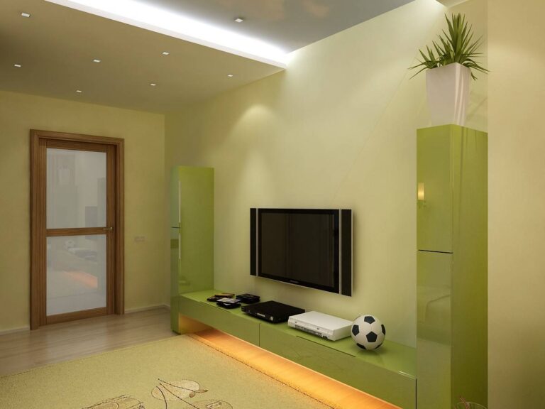 Шкаф с тумбой для техники в зеленых тонах в оформлении спальни