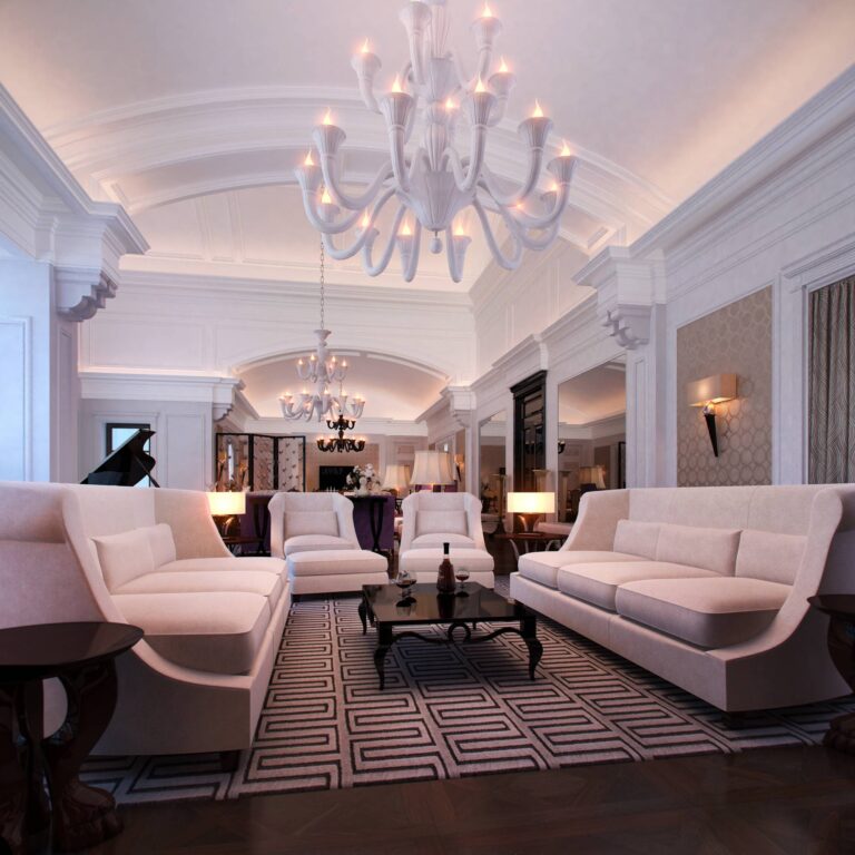 Белая мягкая мебель и черный резной столик в дизайне гостиной