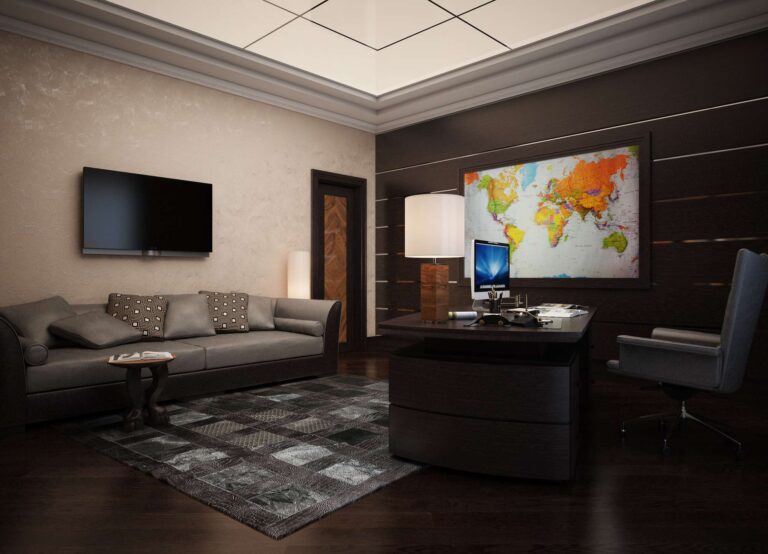 Серое кресло и коричневый рабочий стол в интерьере кабинета