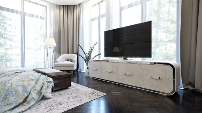 Светло-серая тумба под ТВ в интерьере спальни