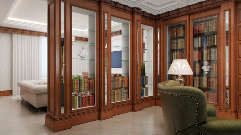 Книжный шкаф со стеклянными стенками в зонировании классического интерьера библиотеки
