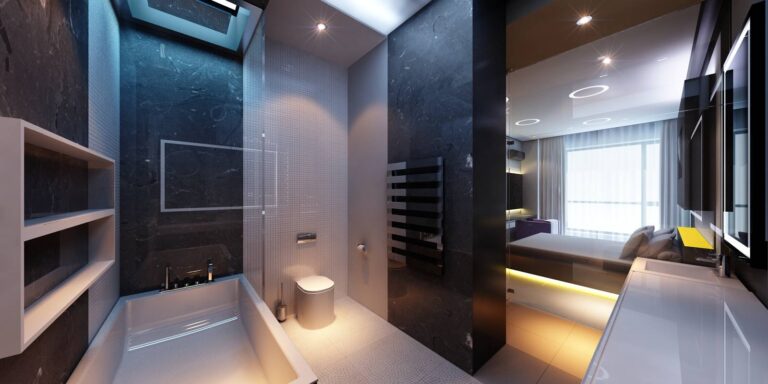 Натуральный камень черного цвета и белая мозаика в дизайне небольшого санузла