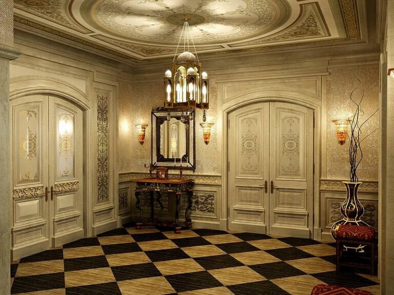 Выбеленный интерьер холла с золотистыми бра на стенах