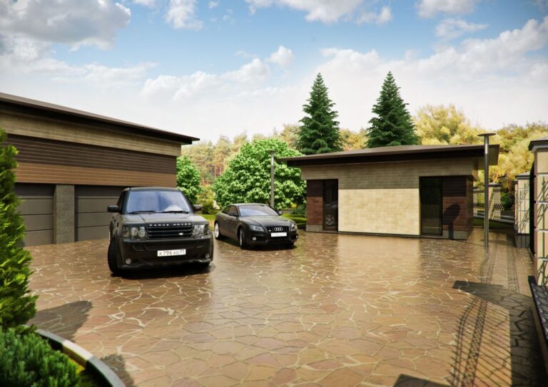 Широкая парковочная площадка из камня в оформлении участка